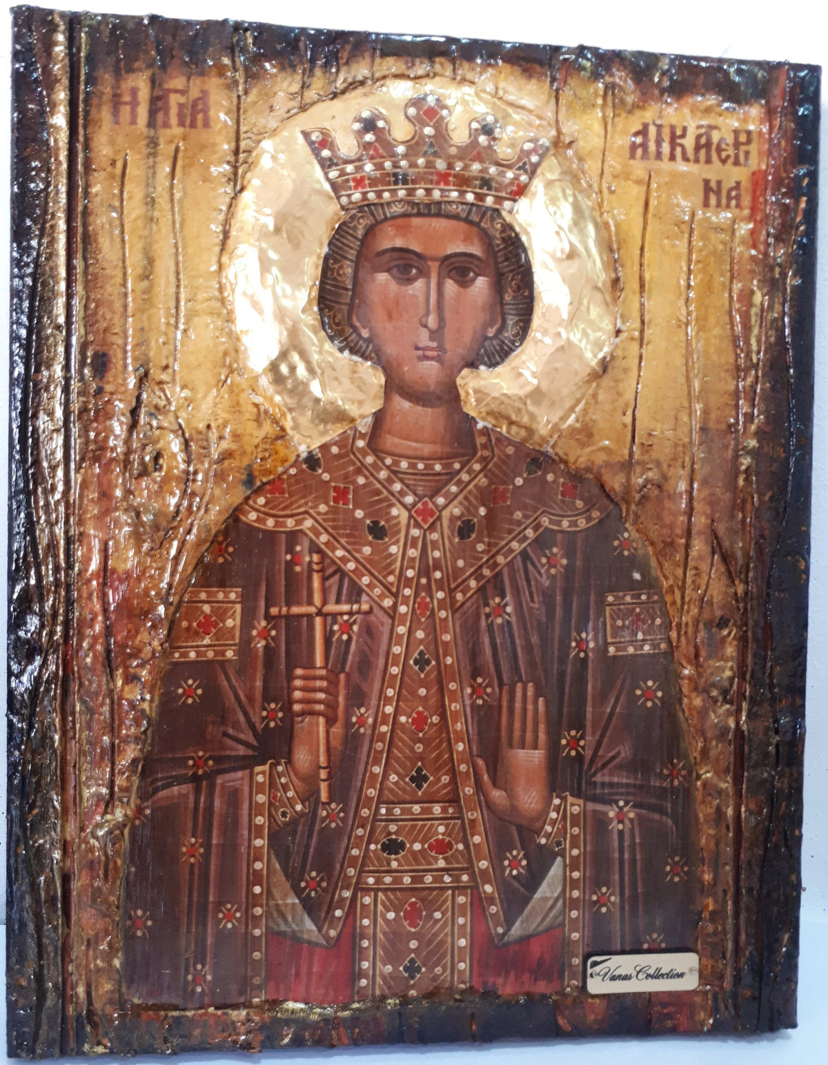 An antique-style religious icon painting of a crowned saint or king on a textured wooden panel with gold leaf, red garments, and dark brown tones, photographed against a plain light background.